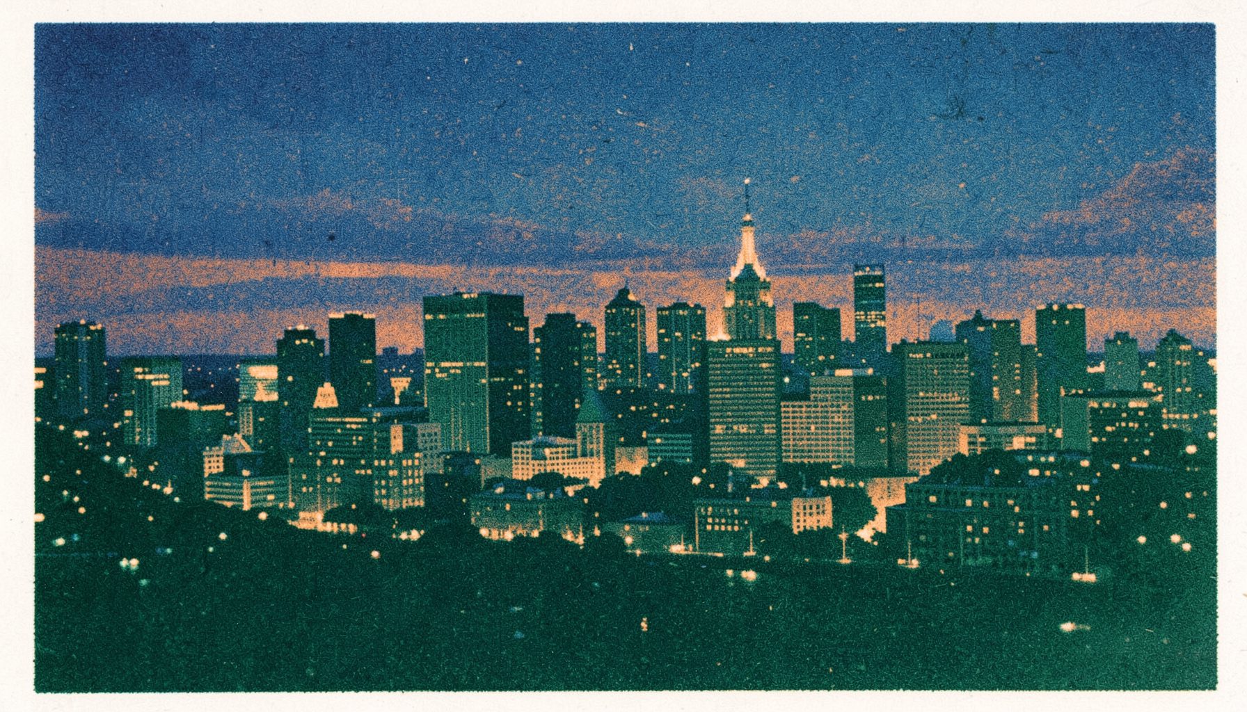 Risograph print of a sprawling American city skyline at twilight, deep blue and warm amber tones, two-ink duotone with soft grain texture