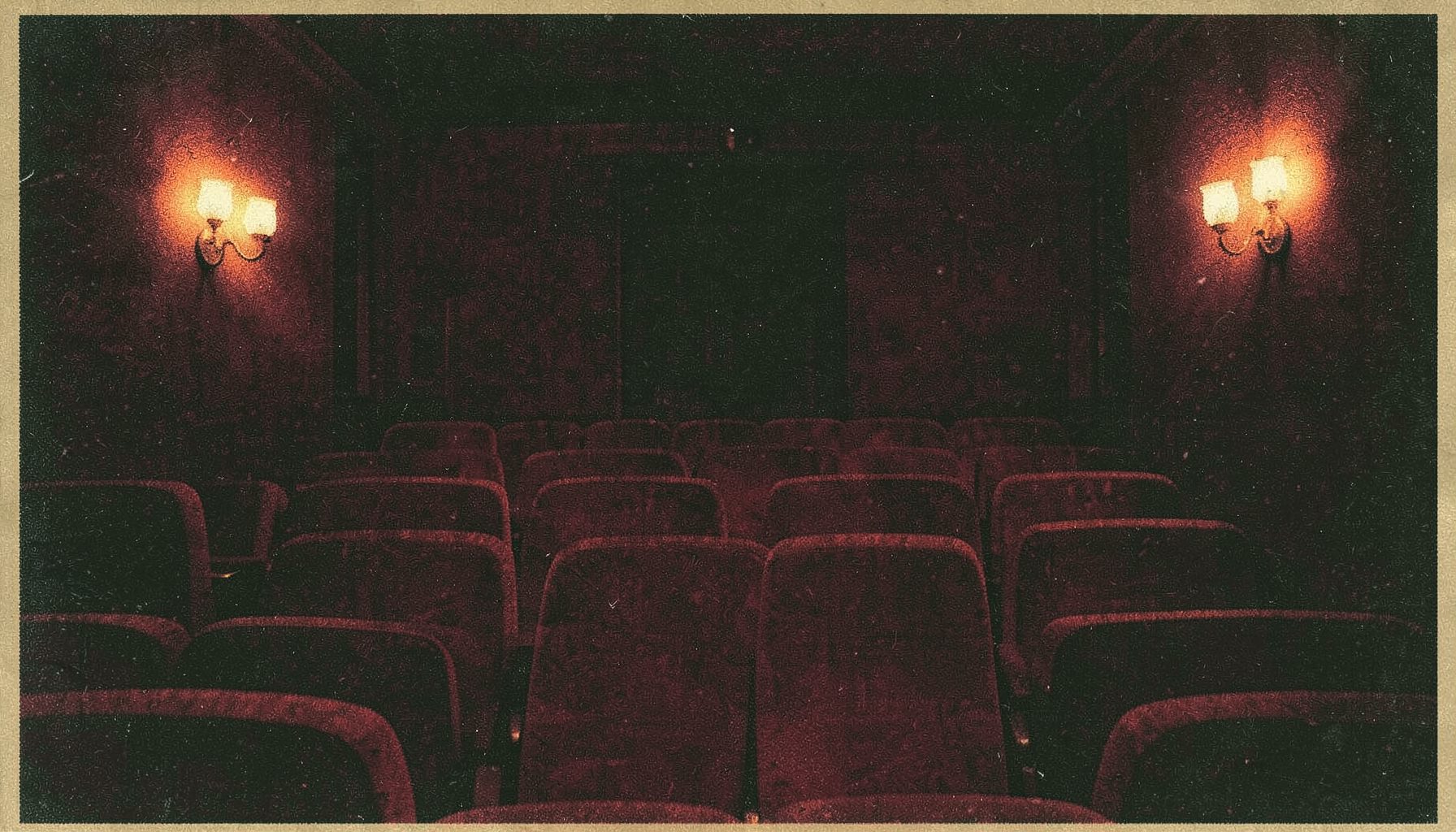 A dimly lit cinema interior with deep red velvet seats and soft amber wall sconces, rendered in a two-ink risograph style using burgundy and warm ochre, evoking a moody late-night atmosphere.